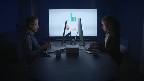 Business Professionals Working Late on Computers