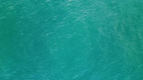 Turquoise Water Waving Agitated Aerial View. Picturesque Deep Blue Sea Surface Making Small Waves...