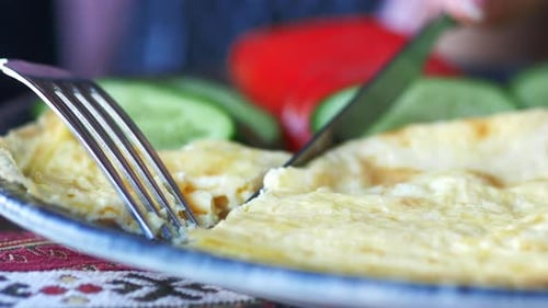 Eating Plain Egg Omelette on Table