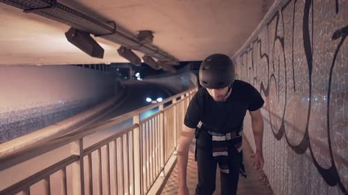 Front and Back View of Guy Skating on Underground Passage Graffiti Walls and Street Art