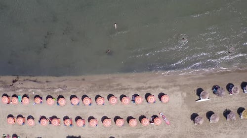 Excellent drone shot. Beach, umbrellas and beautiful sea.