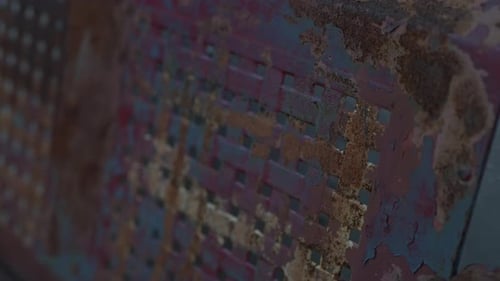 Slow motion close up of a vintage rusted iron seat