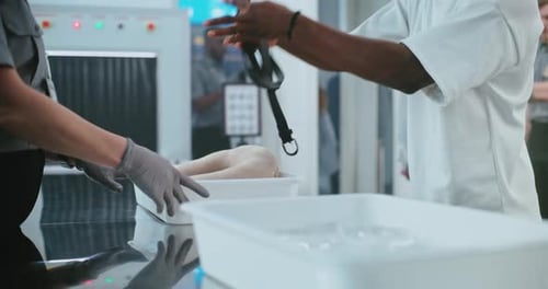 Airport Security Checkpoint: Passengers Preparing for Screening