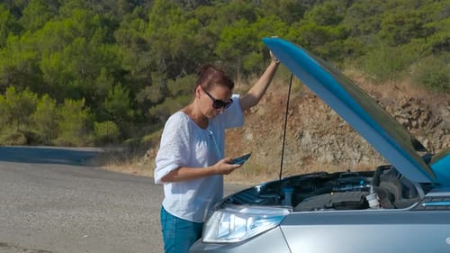 Female Driver with a Broken Car