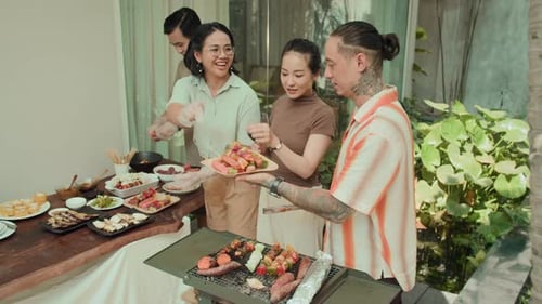 Friends Gather for Casual Outdoor Barbecue and Grilling