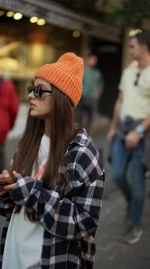 Stylish Woman Using Phone on City Street