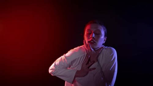 Distressed Woman Clutches Neck, Chest, and Stomach