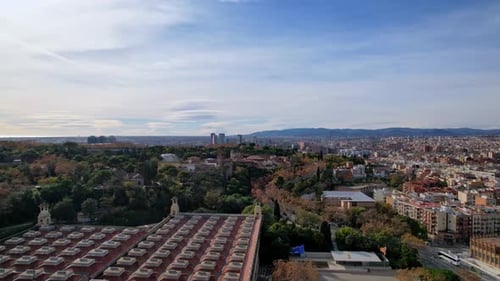 Panoramic aerial drone rooftop view near Montjuic Hill, southern part of city with roundabout