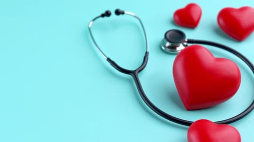 Stethoscope and Pulsating Hearts on Blue Background
