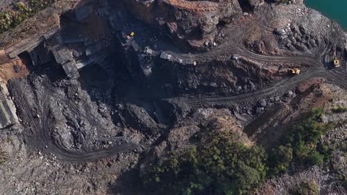 Aerial View of Quarry Excavation with Heavy Machinery