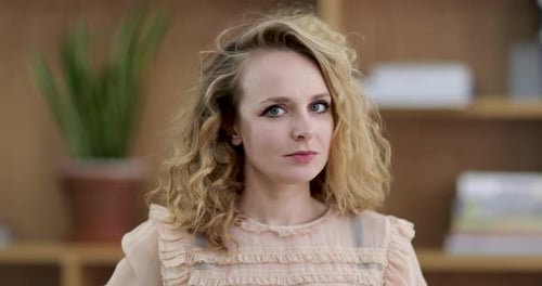 Portrait of young adult female looking to camera