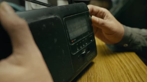 Hand manually Adjusts wave Frequency on Retro transistor Radio Dial