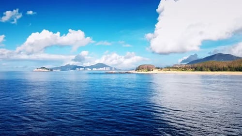 Aerial Top view of a transparent blue sea with beautiful waves at sunny day in summer. air of ocean