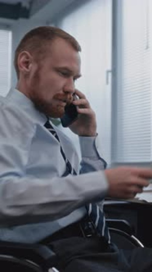 Analyst Discussing Results of Sales Department with Colleague on Mobile Phone