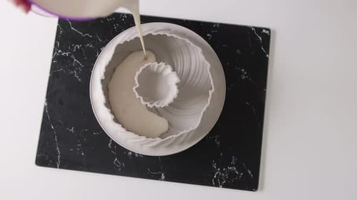 Pouring Cake Batter in Decorative Pan