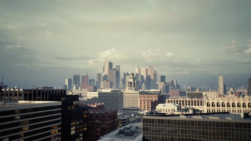 Photographer Capturing Urban Expansion with Luminous Building Views