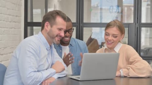 Teamwork and Collaboration Around Laptop Computer