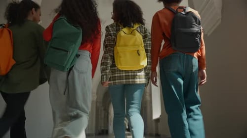 Back View Group Four Multiracial Students Walking University College Corridor Diversity Friends