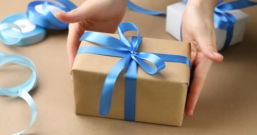 Present with blue bow on table