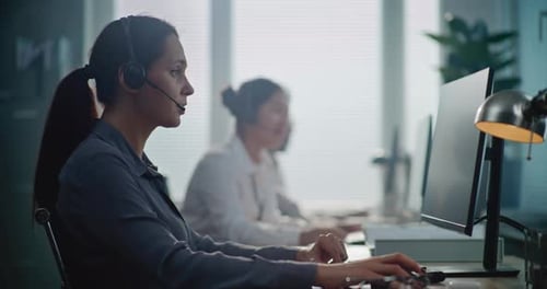 Portrait of Caucasian Hotline Operator Talking on Headset Providing Online Assistance for Client