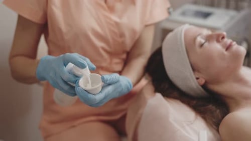 Woman Receives Facial Treatment at Spa