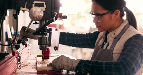 Carpenter woman, industrial drill and workshop for wood construction, check