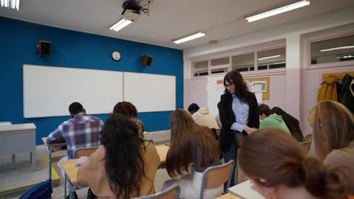 Classroom of Students with Teacher Supervising