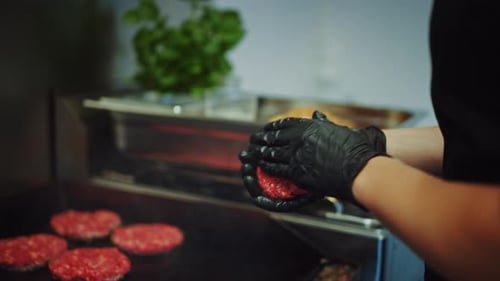 Tasty Close Up Footage of a Meat Patty Being Prepared on a Griller. Fresh Ground Beef is Being Put