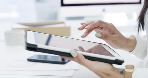 4k video footage of an unrecognizable businessperson using a digital tablet at work