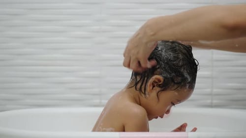 Washing Child's Hair in the Tub