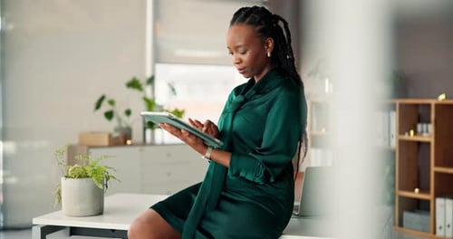 Tablet, typing and business black woman in office for research, website and financial review