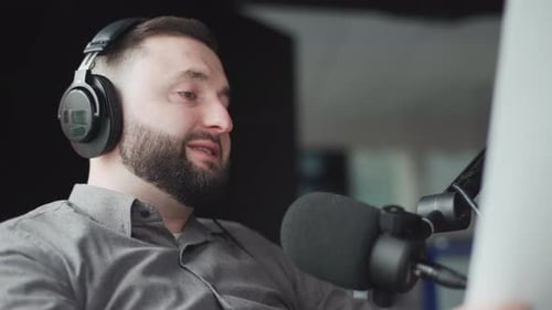 Man Talking into Microphone in Recording Studio