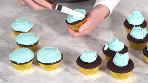 Decorating Chocolate Cupcakes with Buttercream Frosting and Rainbow Candy