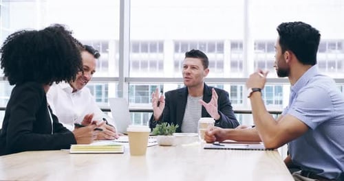 Diverse Colleagues Discussing Ideas in Bright Office