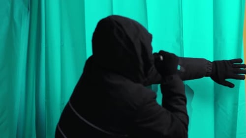 Shocked Man Menaced by Hooded Assailant with Knife