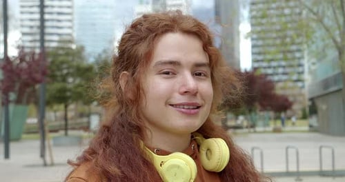 Portrait of Nonbinary Teenager Looking at Camera Smiling Millennials Generation z LGBT People