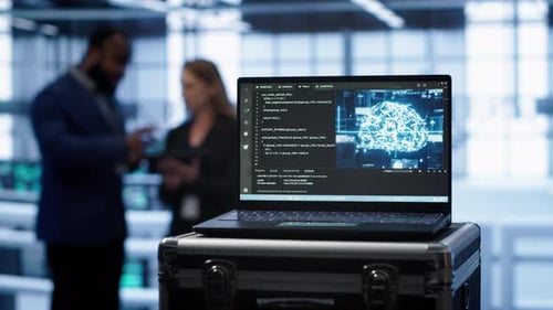 Focus on Laptop in Data Center with AI Brain Used By Engineers in Background