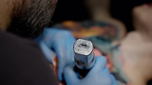 Tattoo Artist Working Close Up in Studio