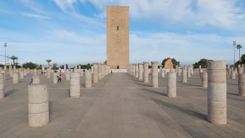 Moroccan Children Playing among Columns at Hassan Tower in Rabat, Morocco