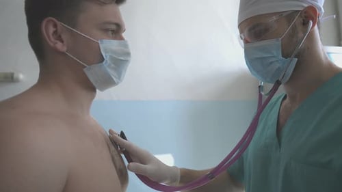Doctor Examines Patient with Stethoscope in Clinic