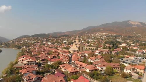 Aerial view of the Svetitskhoveli Cathedral in the city of Mtskheta, Georgia, and the main river of