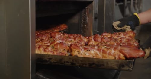 Savory Meat Removed From Commercial Oven