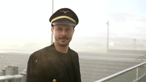 Young Man in Pilot Uniform at Airport