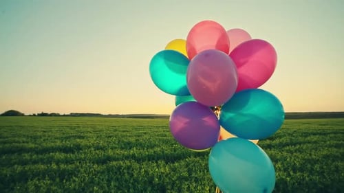Little Girl Child Kid with Balloons Outdoors on Sky and Field Background
