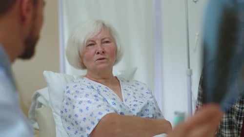 Closeup Male Doctor and Female Old Patient Beautiful Woman Having Consultation in Private Clinic