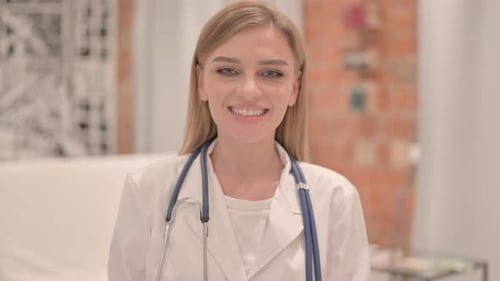 Portrait of Smiling Female Doctor in Clinic