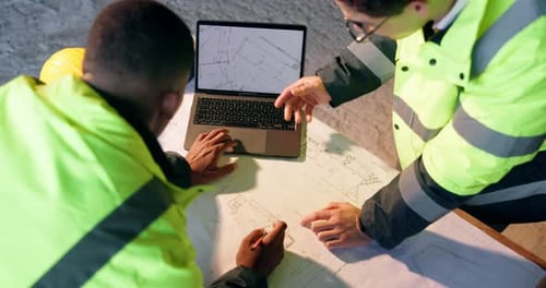 Architect, laptop screen and men with blueprint on construction site, talk and property development