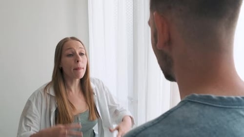 Woman Arguing and Gesturing During Heated Conversation