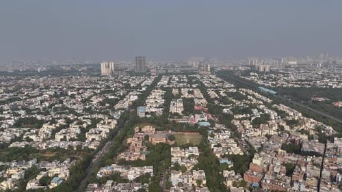 Drone perspective of Noida capturing long-distance visibility of highways and surrounding urban