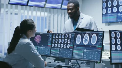 Doctors Review Brain Scans at Computer in Office